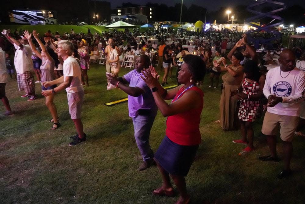 People dance as they listen to music at the Jefferson Street Jazz & Blues Festival July 23, 2022, in Nashville, Tenn. Hundreds of tourism-related projects nationwide, including the festival, collectively are getting about $2.4 billion from the American Rescue Plan, according to an Associated Press analysis of funds flowing from last year’s wide-ranging coronavirus relief law. (AP Photo/Mark Humphrey)