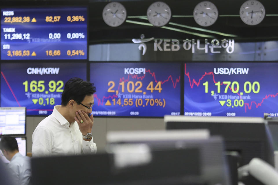 A currency trader watches monitors at the foreign exchange dealing room of the KEB Hana Bank headquarters in Seoul, South Korea, Monday, Oct. 28, 2019. (AP Photo/Ahn Young-joon)