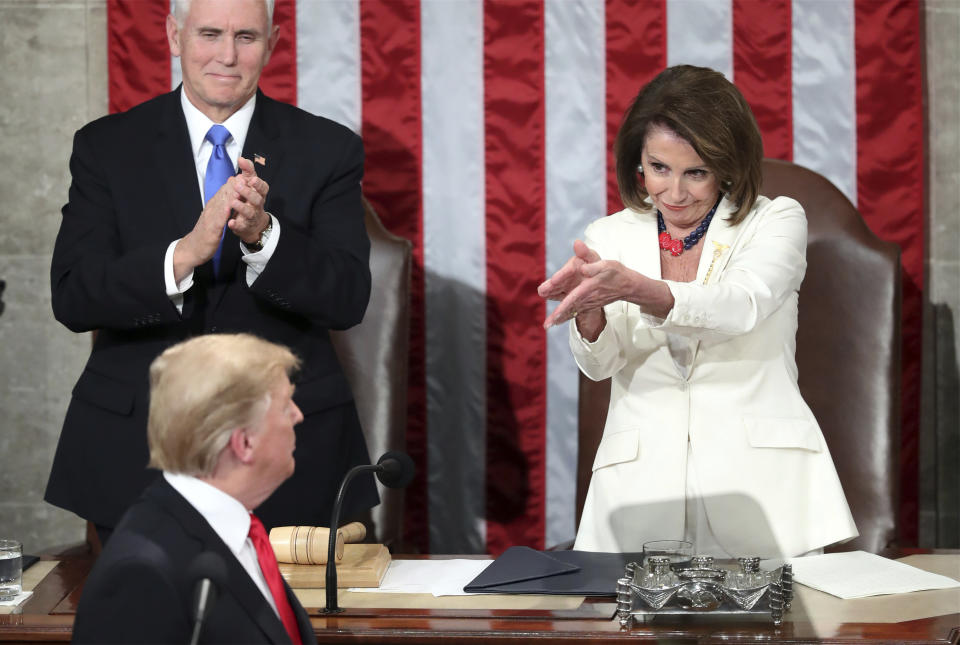 FILE - President Donald Trump turns to House Speaker Nancy Pelosi of Calif., as he delivers his State of the Union address to a joint session of Congress on Capitol Hill in Washington, as Vice President Mike Pence watches, Tuesday, Feb. 5, 2019. (AP Photo/Andrew Harnik, File)