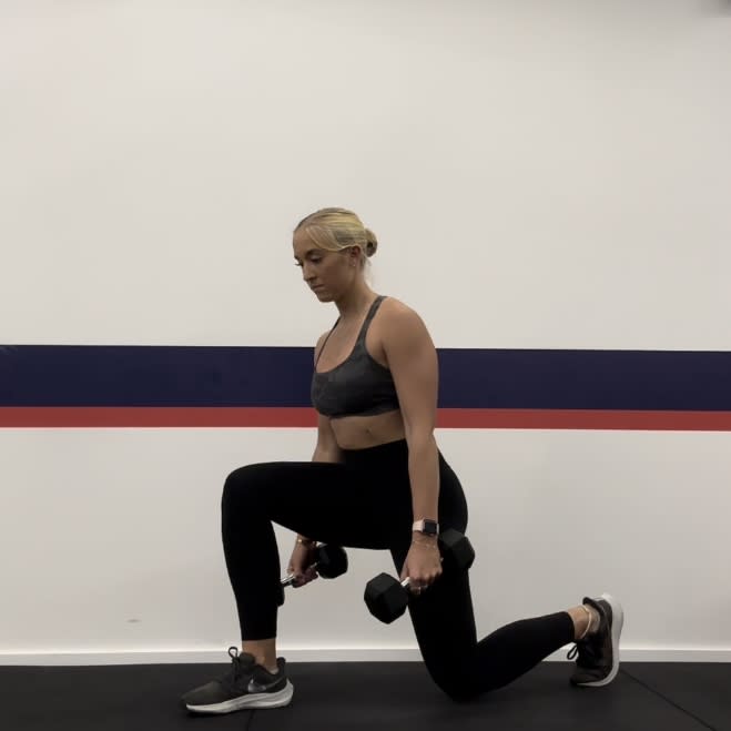 Personal trainer Klaudia Lucia demonstrating a dumbbell reverse lunge