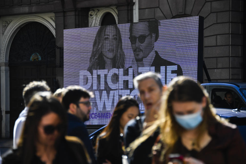 An advertising van is parked outside the High Court, in London, Monday, July 20, 2020. Amber Heard started Monday to give evidence at the High Court in London as part of Johnny Depp’s libel case against The Sun over allegations of domestic violence during the couple's relationship. (AP Photo/Alberto Pezzali)