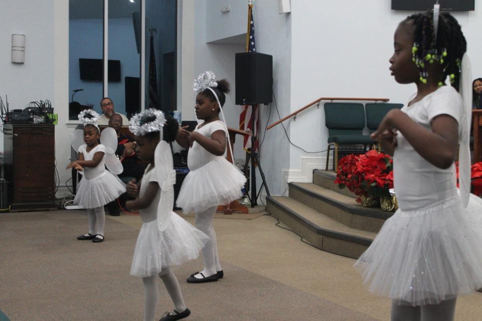 The New Testament Dancers, dressed as angels, perform during the joint Watch Night service held at DaySpring Baptist Church with Emanuel Baptist Church on New Year's Eve.
(Photo: Photo by Voleer Thomas/For The Guardian)