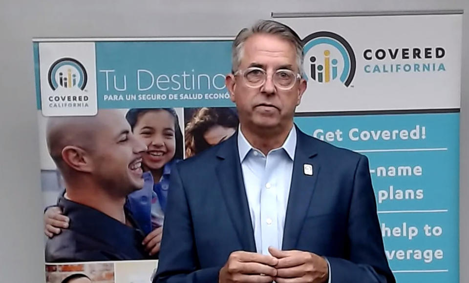 This image provided by Covered California shows Covered California Executive Director Peter Lee participating in a virtual news conference on Monday, April 12, 2021. Lee announced that Covered California is re-opening enrollment to let people purchase health care coverage through the end of the year. Lee said his goal is to get people to take advantage of new federal subsidies that can lower their monthly premiums by $1,000 or more in some cases. (Covered California via AP)