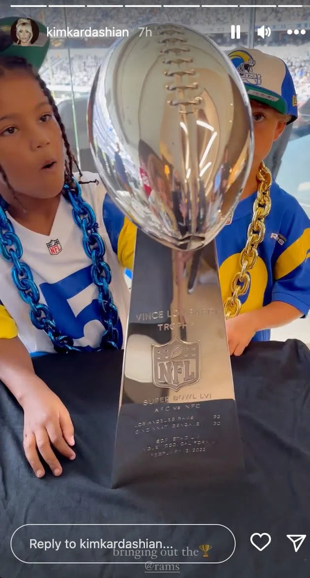Saint and a friend check out the Rams' Vince Lombardi Trophy for winning the Super Bowl. (Photo: Instagram)