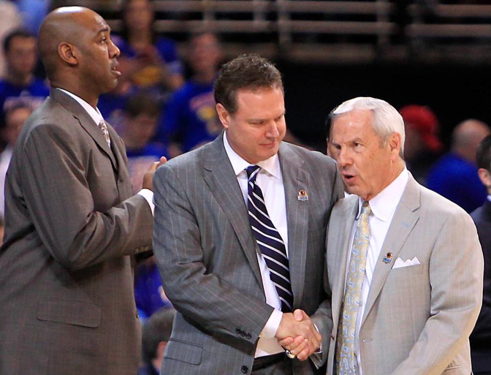 North Carolina coach Roy Williams (right) shakes hand with KU coach Bill Self before a 2012 NCAA Midwest Regional final at the Edward Jones Dome in St. Louis.