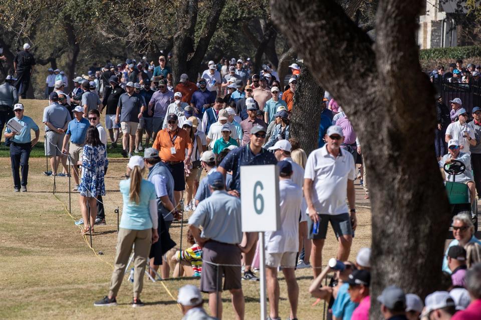 Fans swarm along Austin Country Club to watch the third-day match between Scottie Scheffler and Matt Fitzpatrick during last year's WGC-Dell Technologies Match Play tournament. The contract between the PGA Tour and the country club expires after this March's event.
