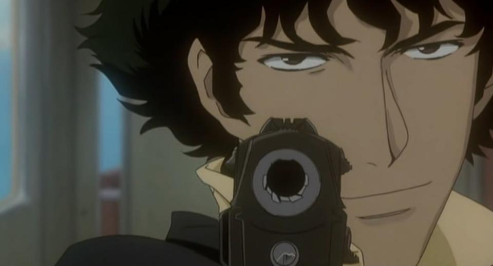 Close-up of Spike pointing a gun at the screen in "Cowboy Bebop"