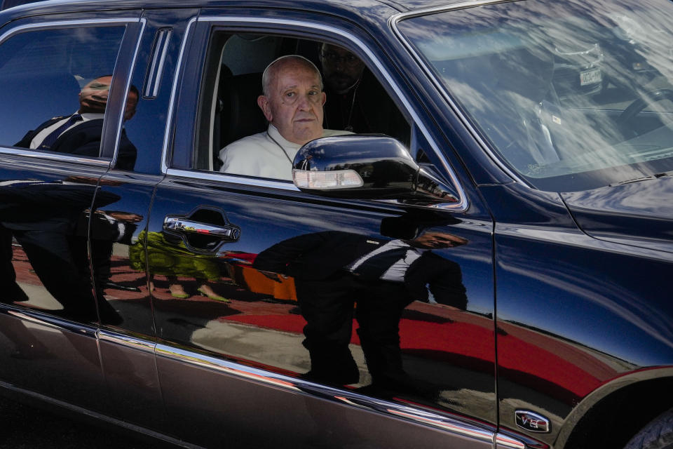 Pope Francis leaves in a car at the end of a meeting with religious leaders at the Hun Theatre some 15 kilometers south of the Mongolian capital Ulaanbaatar, Sunday, Sept. 3, 2023. Pope Francis has praised Mongolia's tradition of religious freedom dating to the times of founder Genghis Khan during the first-ever papal visit to the Asian nation. (AP Photo/Ng Han Guan)