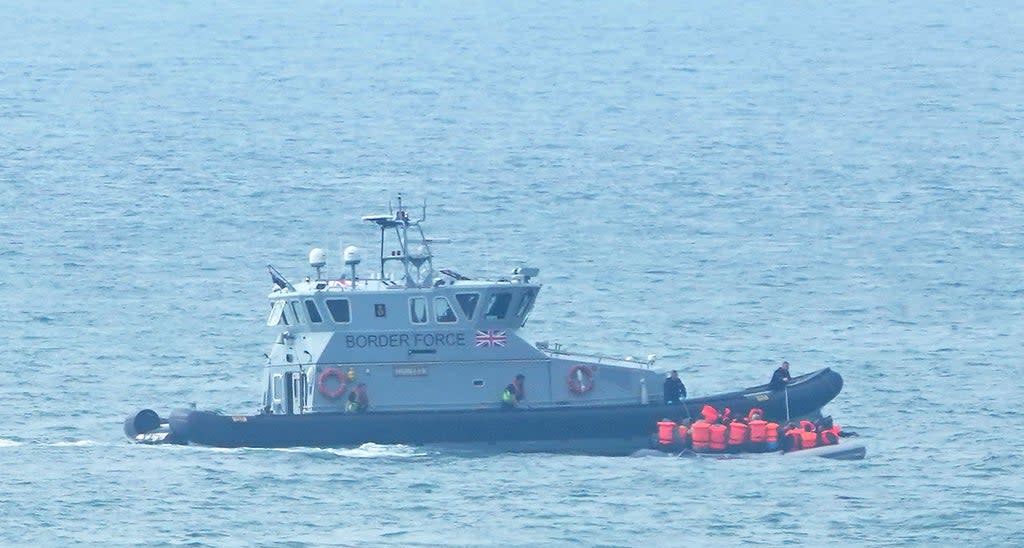 A Border Force vessel intercepts a group of people thought to be migrants in a small boat off the coast of Kent (Gareth Fuller/PA) (PA Wire)