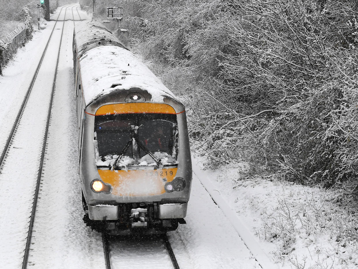 A train travels through snow at High Wycombe, west of London: EPA