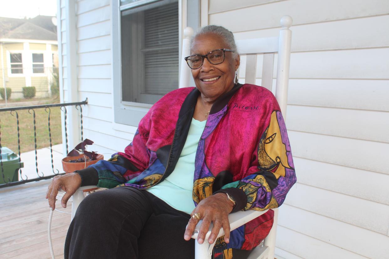 Linda Pearce Thomas sits on the front porch of her Wilmington home on Nov. 29. Pearce Thomas founded and served as the executive director of Elderhaus in Wilmington for more than 30 years. These days she hosts conversations on her front porch -- which she calls her Front Porch Pulpit -- with friends, neighbors and Wilmington leaders.