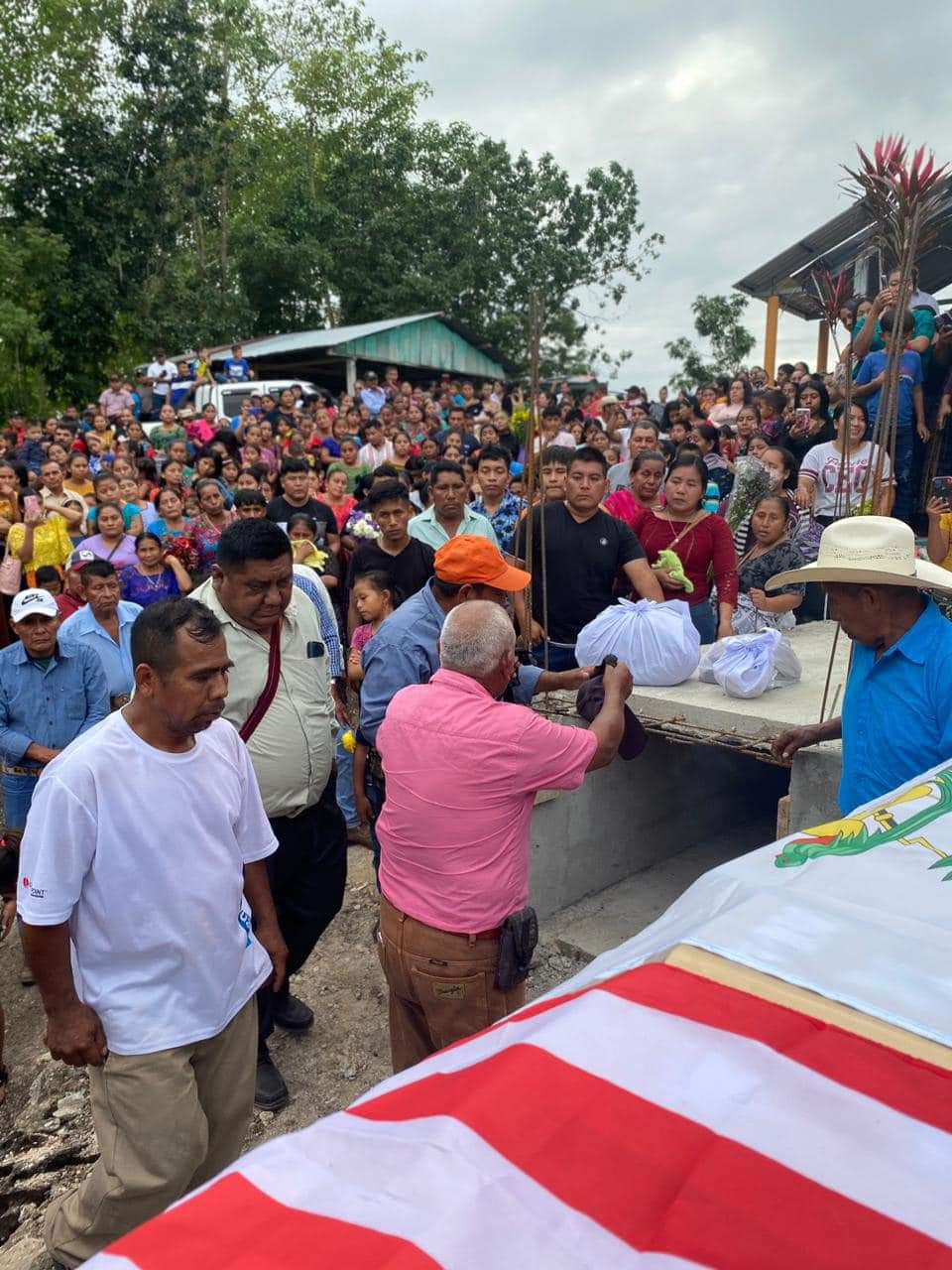 A crowd watches the interment of Emmanuel Pop Ba on Jan. 2, 2024, in La Caoba, Petén, Guatemala. Pop Ba was one of four Austin victims of the Dec. 5, 2023, shooting rampage.