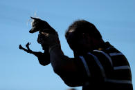 <p>Jason Wurtz holds his up dog Sweepee Rambo, a blind Chinese Crested chihuahua. (Justin Sullivan/Getty Images)</p>