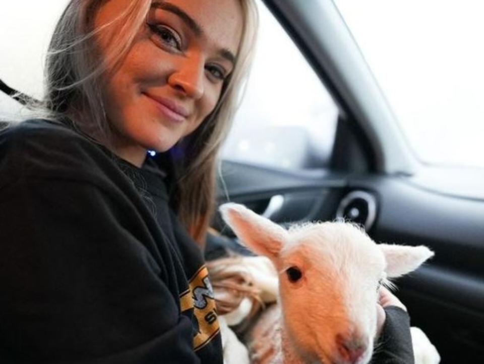 Vegan animal activist - Tash Peterson with a newborn lamb she stole from a farm. Picture: Instagram