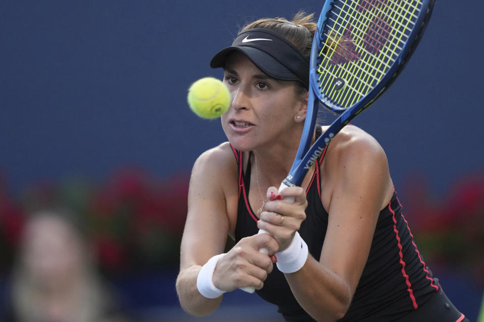 Belinda Bencic, of Switzerland, hits a return to Serena Williams, of the United States, during the National Bank Open tennis tournament Wednesday, Aug. 10, 2022, in Toronto. (Nathan Denette/The Canadian Press via AP)