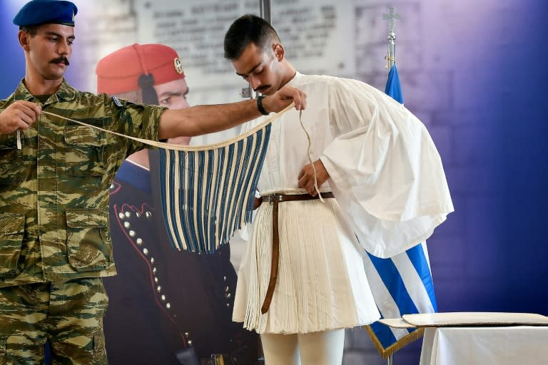 Lialis gets help putting on his ceremonial foustanella skirt, which has 400 pleats to symbolise Greece's occupation by the Ottoman Empire for nearly 400 years
