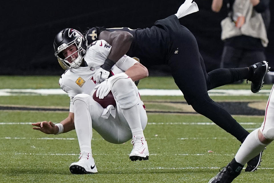 Atlanta Falcons quarterback Matt Ryan is sacked by New Orleans Saints outside linebacker Demario Davis in the second half of an NFL football game in New Orleans, Sunday, Nov. 22, 2020. (AP Photo/Butch Dill)