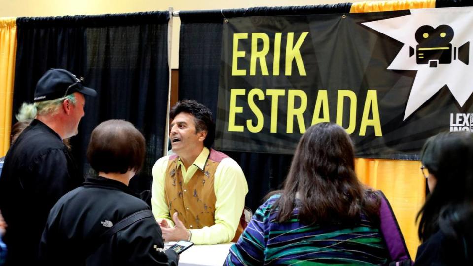 Actor Erik Estrada meets with fans before taking a picture during the 2022 Lexington Comic and Toy Convention at the Central Bank Center. Celebrities are available to meet, for autographs and pictures.