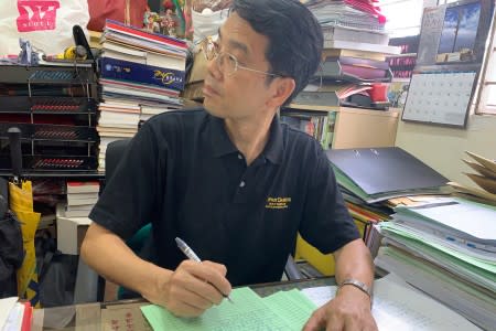 Zachary Wong, Democratic Party district councillor, sits in his office in Yuen Long