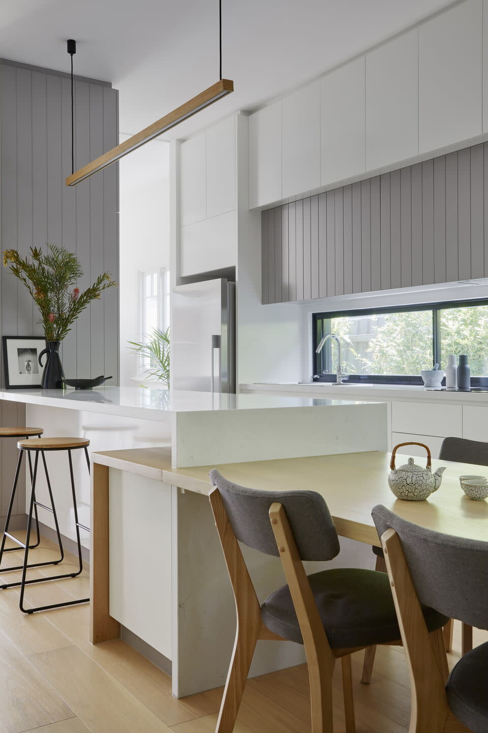 A modern kitchen with wooden paneling