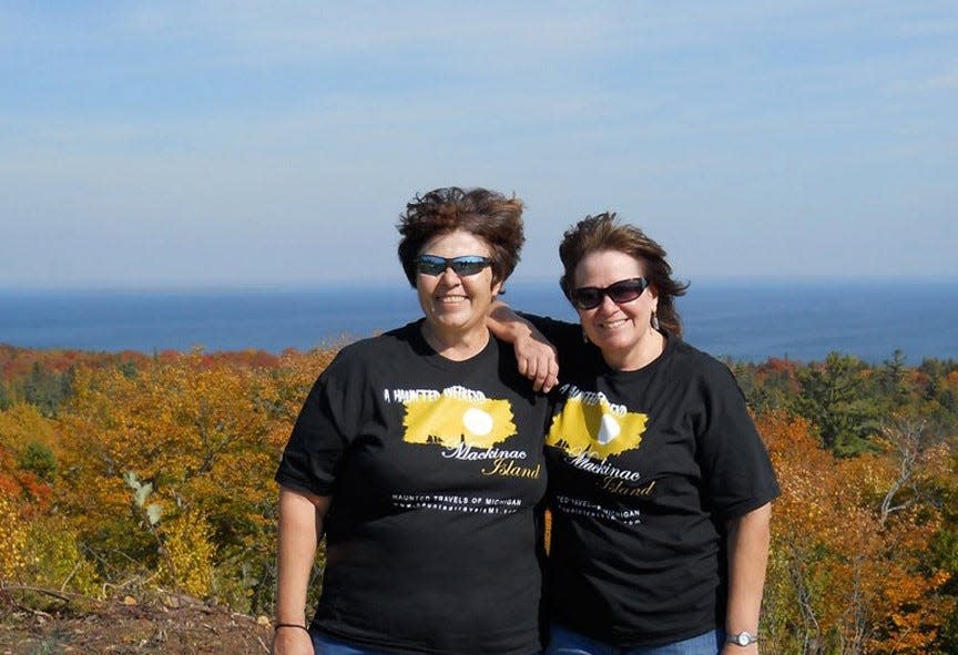 Author and paranormal investigator Kat Tedsen, right, is shown with her sister Bev Rydel, left, at the top of Fort Holmes on Mackinac Island. Tedsen insists Fort Holmes is a supernatural force to be reckoned with.
