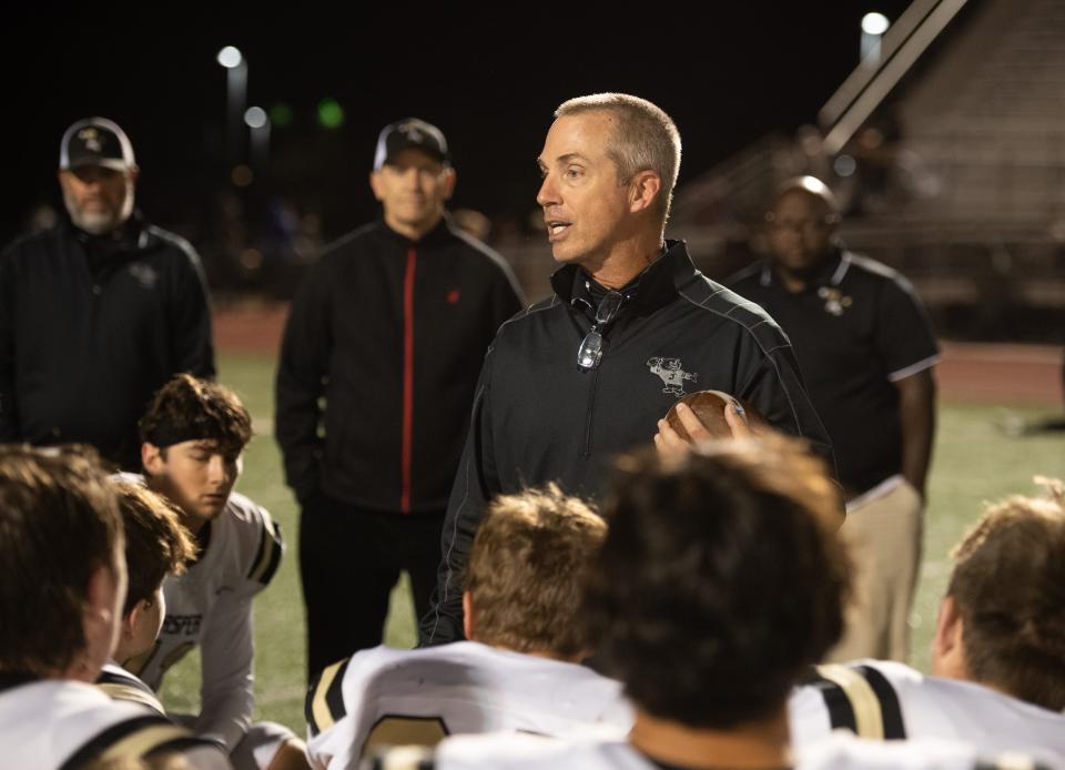 Jasper Head Coach Tony Lewis speaks to the team after their victory over the North Huskies at Bundrant Stadium in Evansville, Ind., Friday evening, Oct. 7, 2022. 