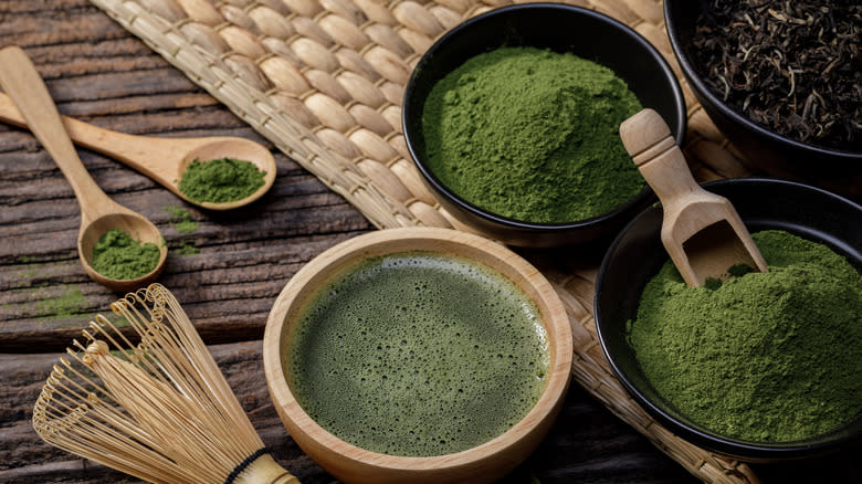 green tea matcha powder in bowls and spoons