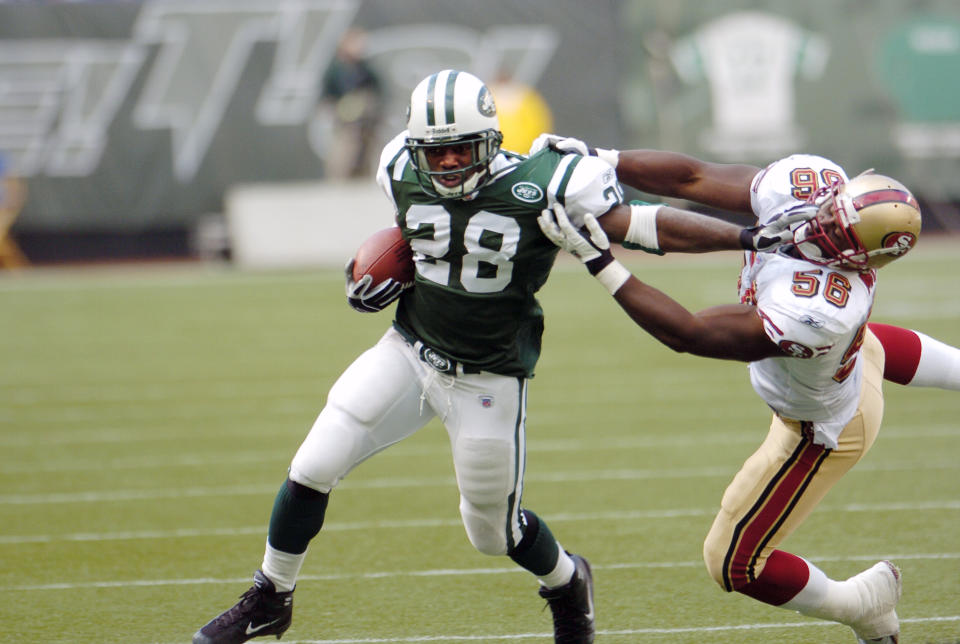 UNITED STATES - OCTOBER 17:  New York Jets' running back Curtis Martin keeps a San Francisco 49ers defender at a safe distance in a game at Giants Stadium. Martin racked up 111 yards and two touchdowns on 25 carries at the Jets came from behind in the second half to win, 22-14. They're now 5-0 on the season for the first time in their 45-year history.  (Photo by Andrew Savulich/NY Daily News Archive via Getty Images)