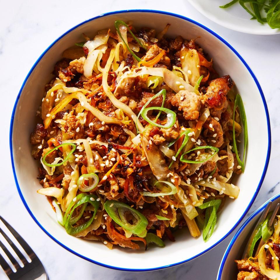 ground pork, cabbage and carrot in a bowl