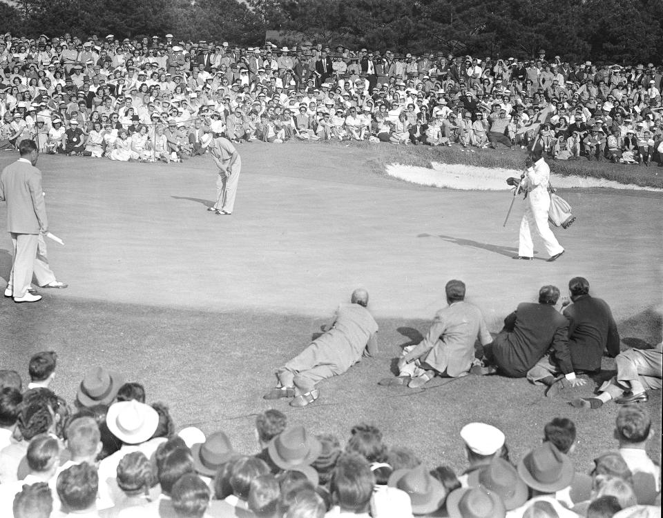 FILE - Sam Snead sinks a 20-foot putt on the 18th green to win the Masters Tournament in Augusta, Ga., April 10, 1949. His win 75 years ago was the first time the champion was presented a green jacket. (AP Photo/Rudolph Faircloth, File)