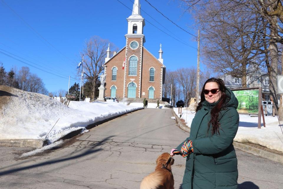 Geneviève Plourde lives a few houses down from where the military set up it's training hub outside the local church. She says it's been nice to see new people in town. 