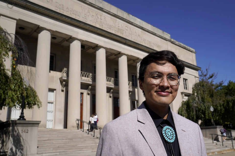 Alvin Donel Harvey, president of the Massachusetts Institute of Technology Native American Student Association, stands for a photograph, Thursday, Oct. 7, 2021, in front of the Walker Memorial building on the schools campus, in Cambridge, Mass. MIT is grappling with the legacy of one of its founding fathers, whose name graces the iconic building. Francis Amasa Walker was a former head of the U.S. office of Indian Affairs who authored The Indian Question, a notorious treatise on Native Americans that helped justify the nation's tribal reservation system. (AP Photo/Steven Senne)