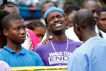 A man reacts outside the entrance of Connaught Hospital in Freetown, Sierra Leone August 16, 2017. REUTERS/Afolabi Sotunde