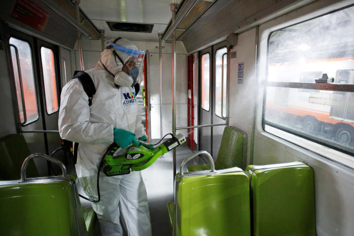 A worker carries out the disinfection of a metro car, as part of Mexico City's government's measures in response to the coronavirus disease (COVID-19), in Mexico City