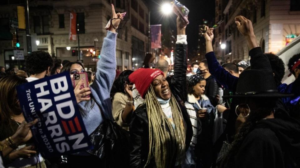 Philadelphians dance in street after listening to President-elect Joe Biden address the nation after being declared winner of the 2020 presidential election. Former Virginia Wesleyan University dean and professor Paul Ewell resigned after his Facebook post in which he called Biden supporters “ignorant, anti-American and anti-Christian.” (Photo by Chris McGrath/Getty Images)