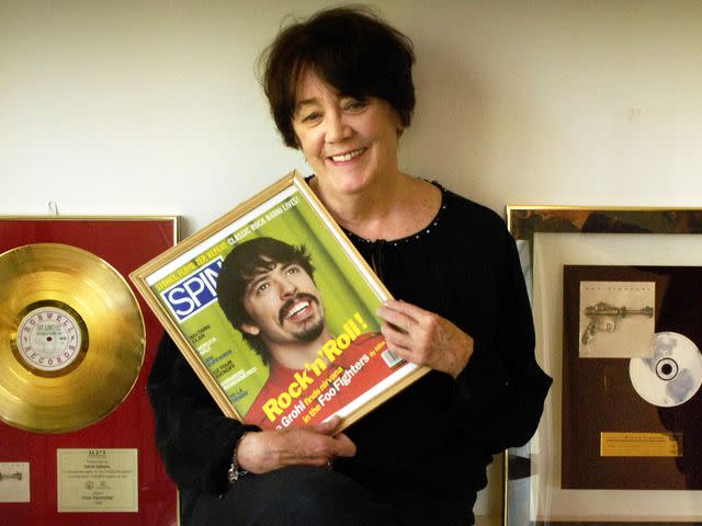 <p>Gerald Martineau/The The Washington Post/Getty</p> Virginia Grohl photographed with a framed cover of a 1977 SPIN magazine with a picture of her son Dave Grohl on April 18, 2008..