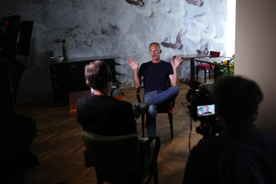 Former NHL goalkeeper Dominik Hasek gestures during an interview with The Associated Press in Prague, Czech Republic, Wednesday, June 28, 2023. The NHL great has been a prominent and vocal critic of the International Olympic Committee's recommendation that Russians and Belarusians could compete in international competitions after being approved as neutrals. (AP Photo/Petr David Josek)