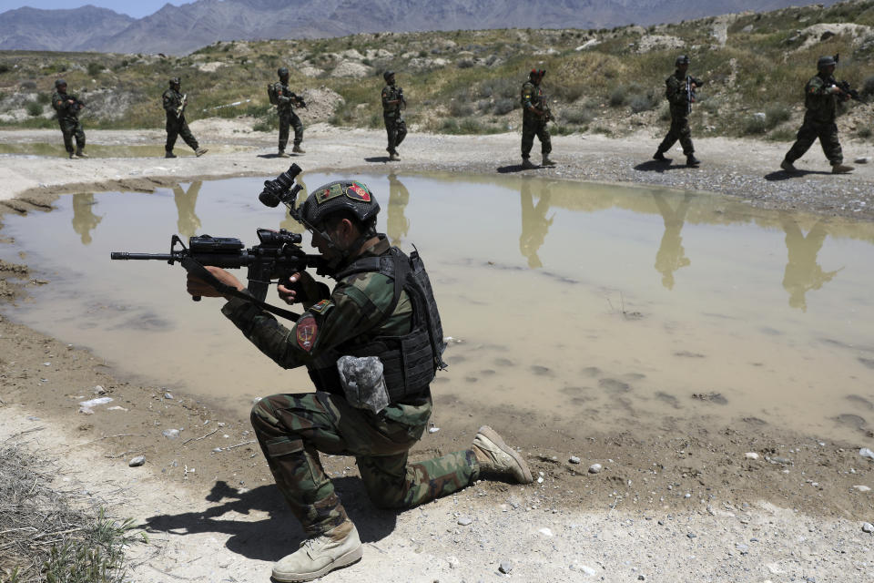 Afghan soldiers patrol outside their military base on the outskirts of Kabul, Afghanistan, Sunday, May 9, 2021. By Sept. 11 2021, at the latest, the remaining U.S.and allied NATO forces will leave Afghanistan, ending nearly 20 years of military engagement. Also leaving is the American air support that the Afghan military has relied on to stave off potentially game-changing Taliban assaults, ever since it took command of the war from the U.S. and NATO in 2014. (AP Photo/Rahmat Gul)