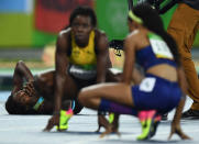 2016 Rio Olympics - Athletics - Final - Women's 400m Final - Olympic Stadium - Rio de Janeiro, Brazil - 15/08/2016.Shaunae Miller (BAH) of Bahamas lies on the track after finishing first REUTERS/Dylan Martinez