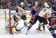 Anaheim Ducks goalie John Gibson (36) makes a save on Edmonton Oilers' Evander Kane (91) during the second period of an NHL hockey game Saturday, April 1, 2023, in Edmonton, Alberta. (Jason Franson/The Canadian Press via AP)