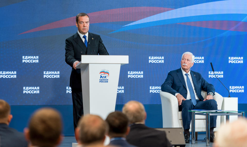 Russian Security Council Deputy Chairman and the head of the United Russia party, Dmitry Medvedev, left, speaks during a joint session of the Supreme Council and the General Council of United Russia party in Moscow, Russia, Wednesday, June 9, 2021. Chairman of the Supreme Council of United Russia Boris Gryzlov is on the right. (Svetlana Schenkel/Sputnik, Government Pool Photo via AP)