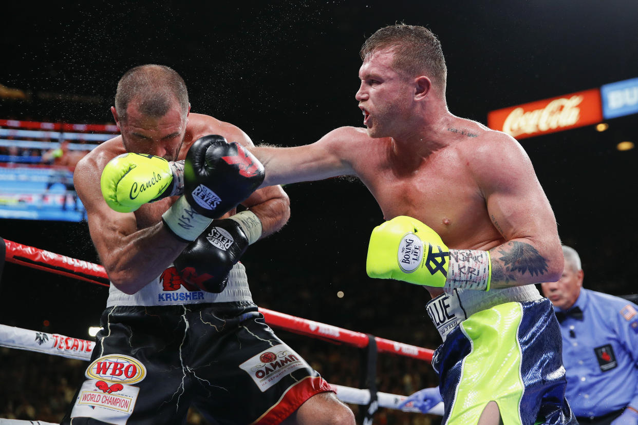 Canelo Alvarez, right, lands a punch against Sergey Kovalev during a light heavyweight WBO title bout, Saturday, Nov. 2, 2019, in Las Vegas (AP Photo/John Locher)