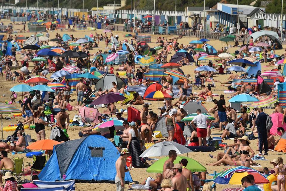 Beachgoers in Bournemouth (AFP via Getty Images)