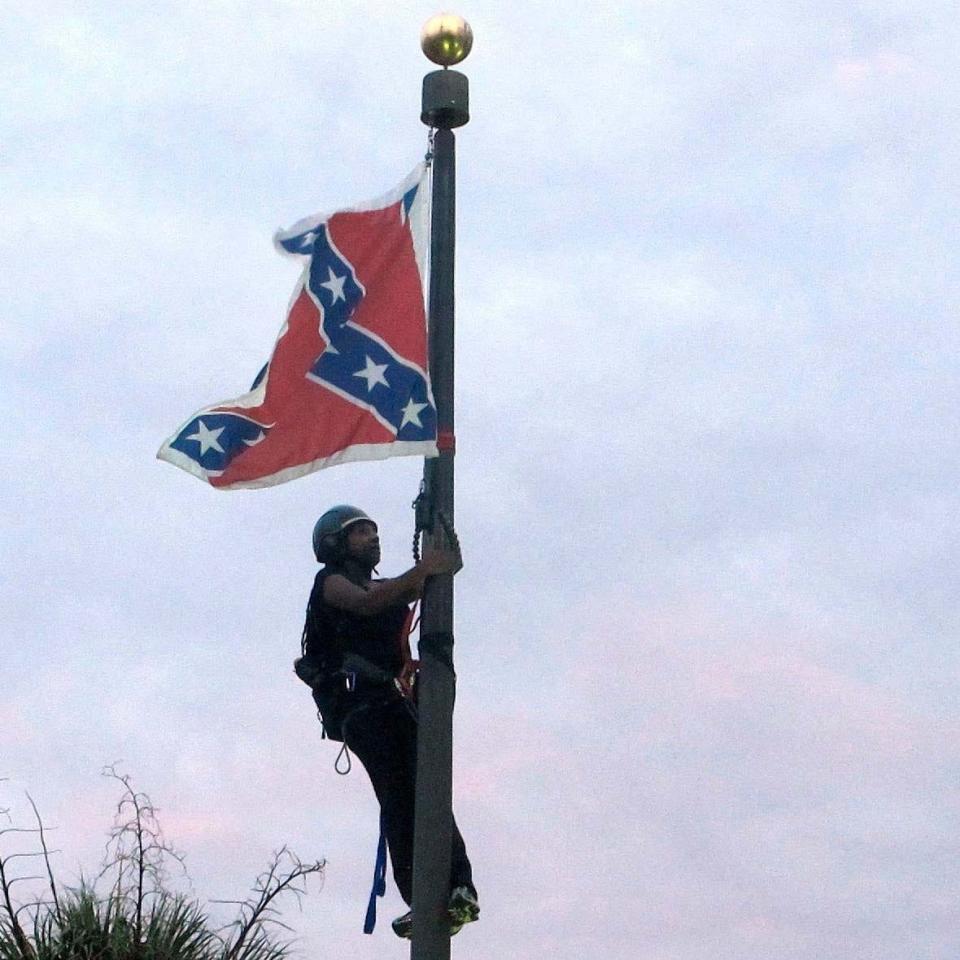 In June 2015, Bree Newsome Bass climbed a flagpole to remove the Confederate battle flag at a Confederate monument in front of the Statehouse in Columbia, S.C.