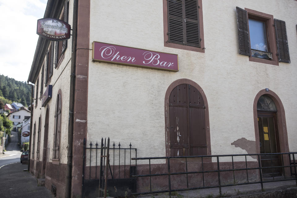 HOLD FOR STORY SLUGGED FRANCE DEATH OF THE BISTROT BY JOHN LEICESTER - This photo taken Tuesday Sept.17, 2019 shows the Open Bar, a closed bistrot in Rothau, eastern France. A mass die-off of France's bars, from 200,000 in 1960 to 36,000 now, fed into the sense of isolation and abandonment that was a driving force behind the so-called "yellow vest" protest movement that rocked France this year. (AP Photo/Jean-Francois Badias)