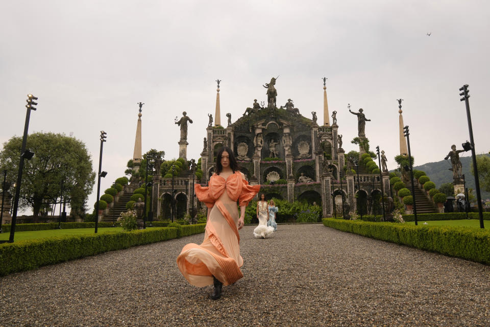 A model wears a creation as part of the women's Louis Vuitton Cruise 2024 collection, unveiled on Isola Bella (Bella Island) on Lake Maggiore in Stresa, northern Italy, Wednesday, May 24, 2023. (AP Photo/Antonio Calanni)