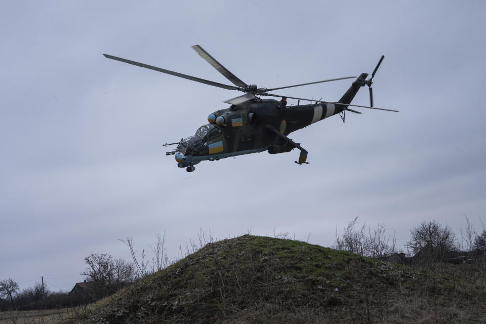 A Ukrainian Mi-24 attack helicopter flies towards Russian positions during a combat mission in Donetsk region, Ukraine, Saturday, March 18, 2023. (AP Photo/Evgeniy Maloletka)