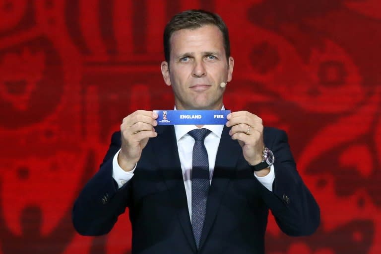 Former German striker Oliver Bierhoff shows the name of England during the preliminary draw for the Union of European Football Associations (UEFA) zone for the 2018 World Cup qualifiers at the Konstantin Palace in Saint Petersburg on July 25, 2015