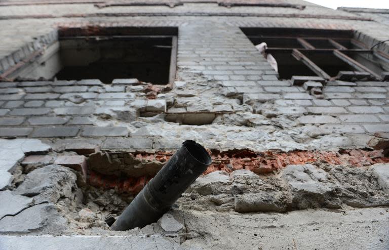 A Grad rocket is lodged in the wall of the Chornukhyne prison in Debaltseve, eastern Ukraine, on February 28, 2015