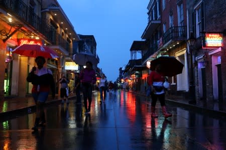 Tourists walk on Bourbon St. during Hurricane Barry in New Orleans